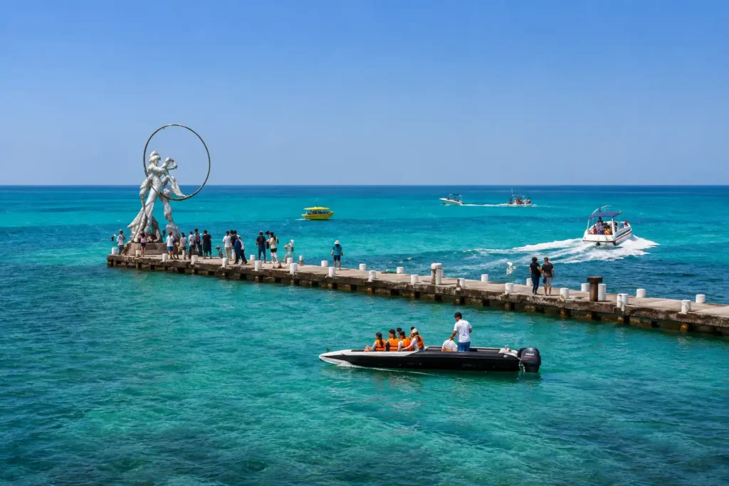 Tourists enjoying water sports and turquoise sea at Kish Island pier in Iran