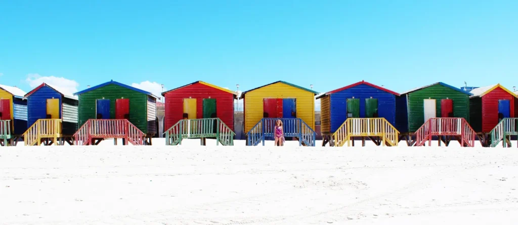 Colorful beach huts near the shore on a tropical island