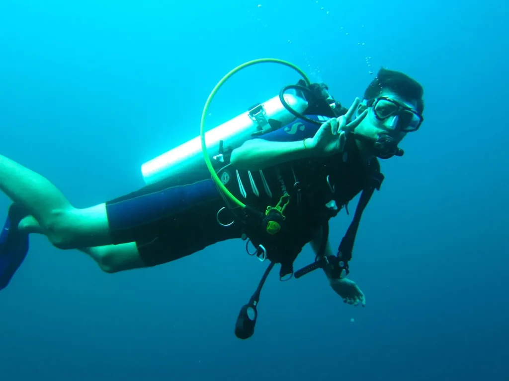 Scuba diver exploring marine life near Perhentian Islands
