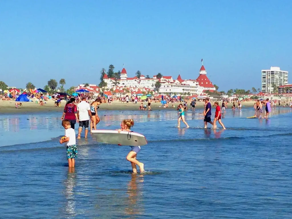 Family-friendly beach atmosphere with travelers enjoying the shoreline