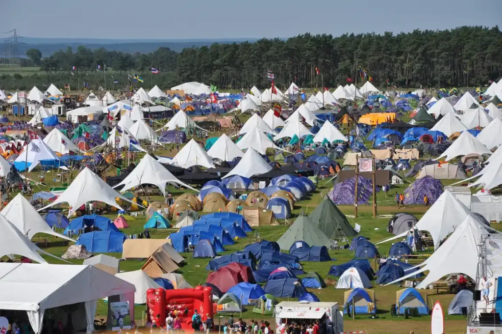Camping tents and temporary campsite setup during outdoor island events.