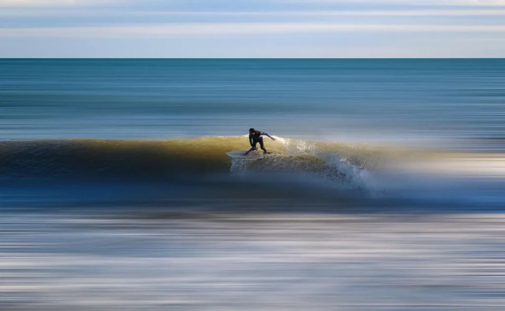 Surfer riding a wave near Kuta Lombok surf breaks
