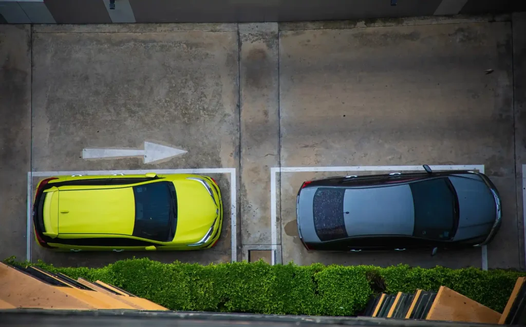 Overhead view of parked cars illustrating parking facilities at Selong Belanak Beach