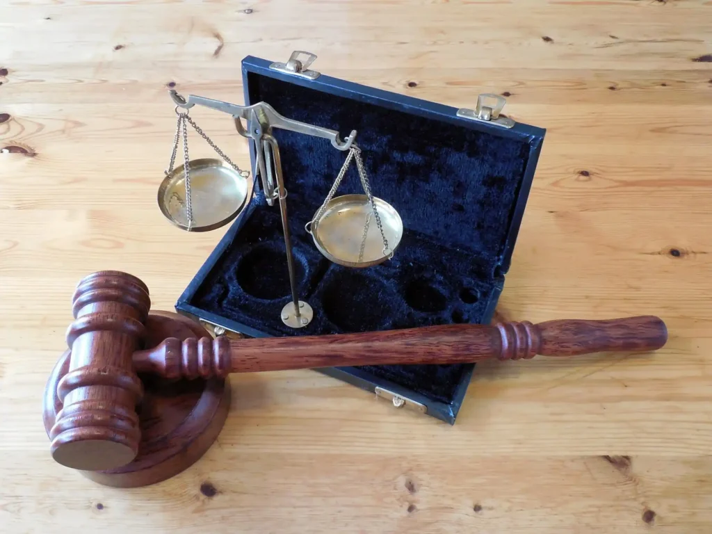 Legal gavel and scales symbolizing beach regulations permits and restricted activities