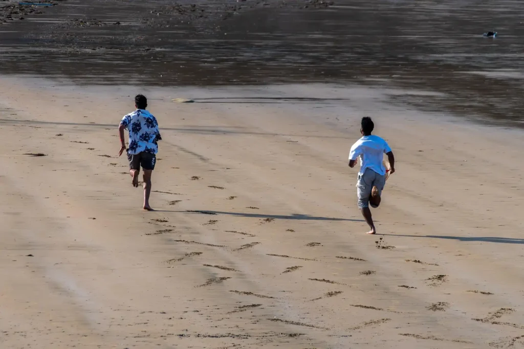 Travelers exploring the wide sandy shoreline near Kuta Lombok
