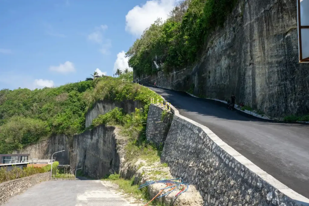 Cliffside road leading toward Bali’s hidden southern coastline.