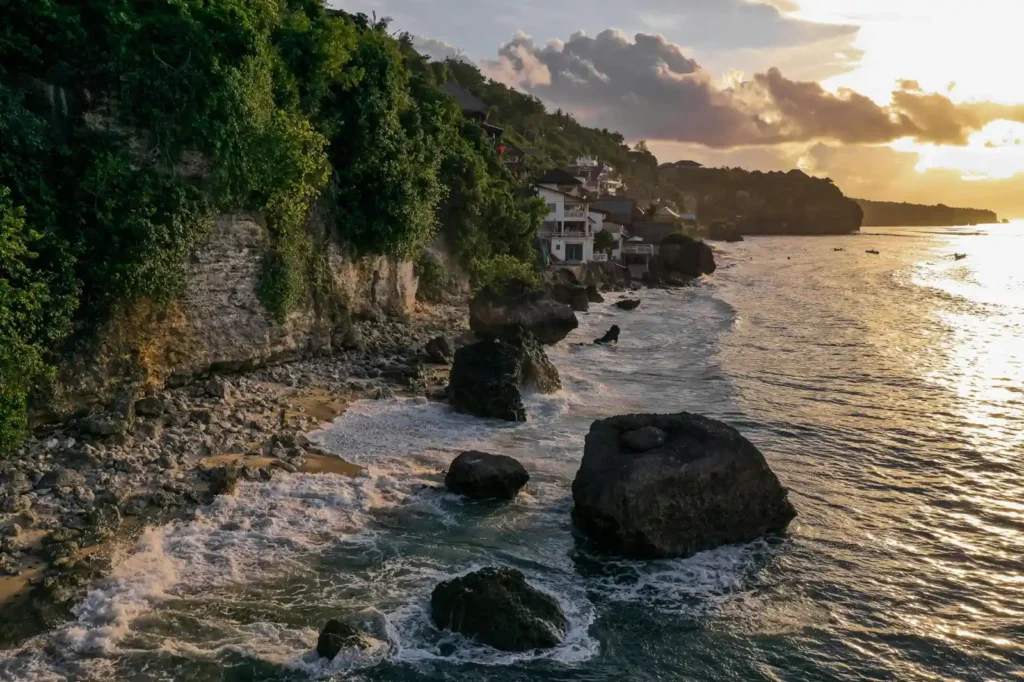 Sunrise light over Bali coastline during calm ocean conditions