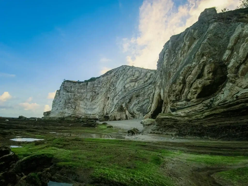 Crystal clear water and limestone cliffs at Melasti Beach Bali