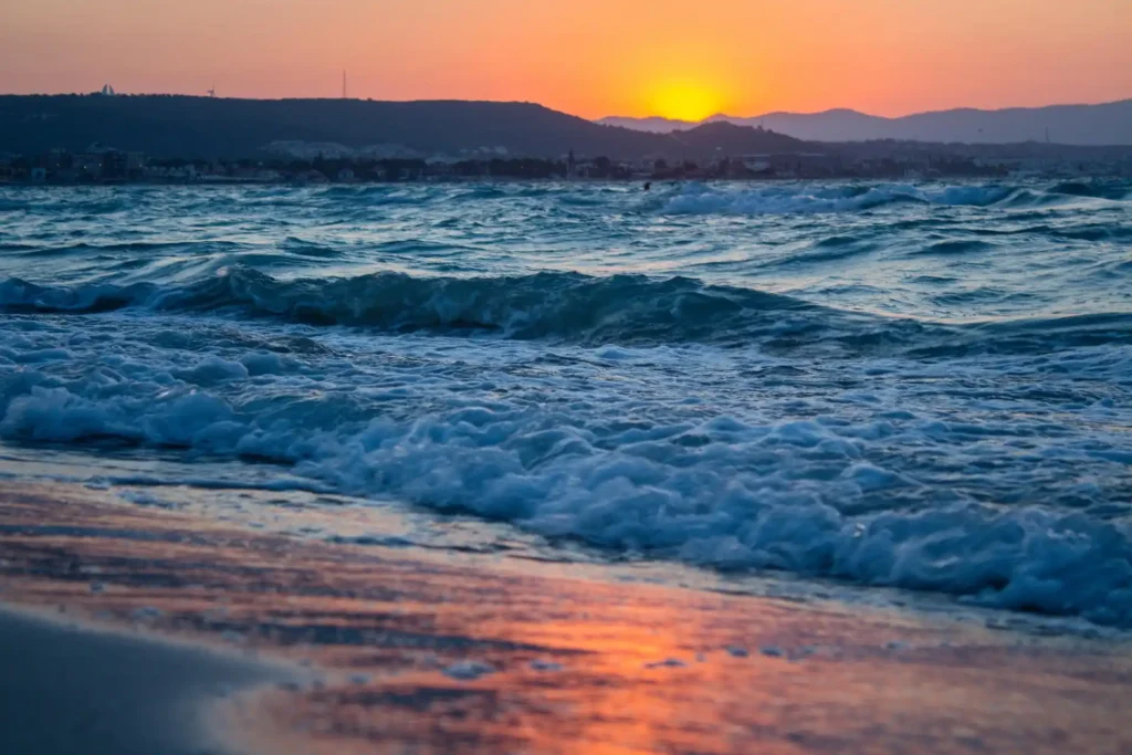 Sunset waves on a Goa beach during golden hour