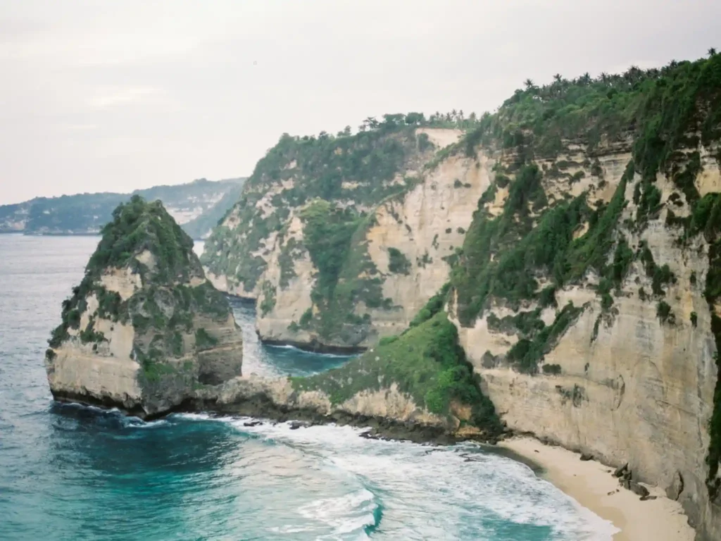 Aerial view of Nyang Nyang Beach with cliffs and turquoise water