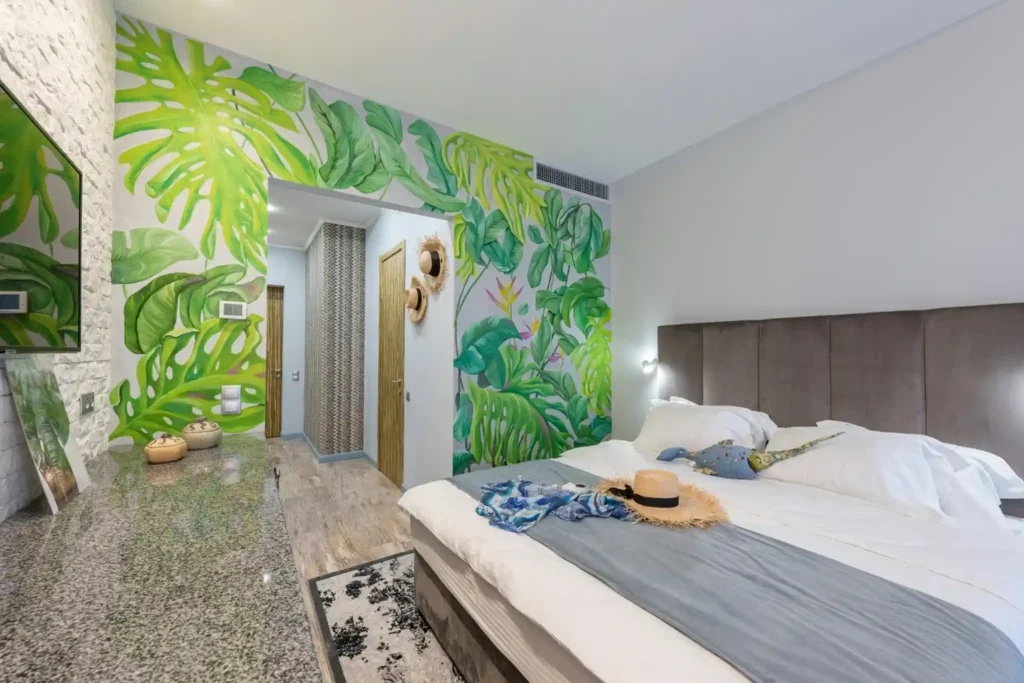 boutique tropical hotel room with modern design and greenery decor
