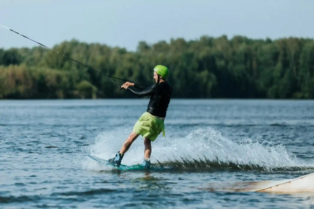 Tourist enjoying wakeboarding and water sports near Gisoom Beach on the Caspian Sea in northern Iran