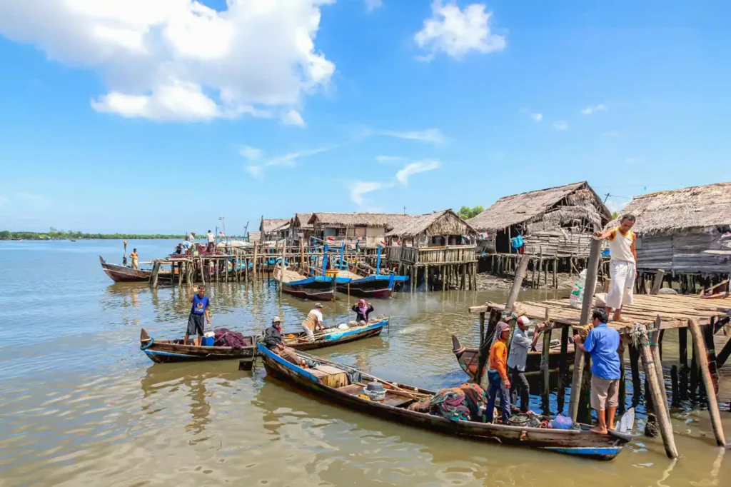 Traditional fishing village with wooden boats and local fishermen on Hengam Island near Qeshm Island in southern Iran.