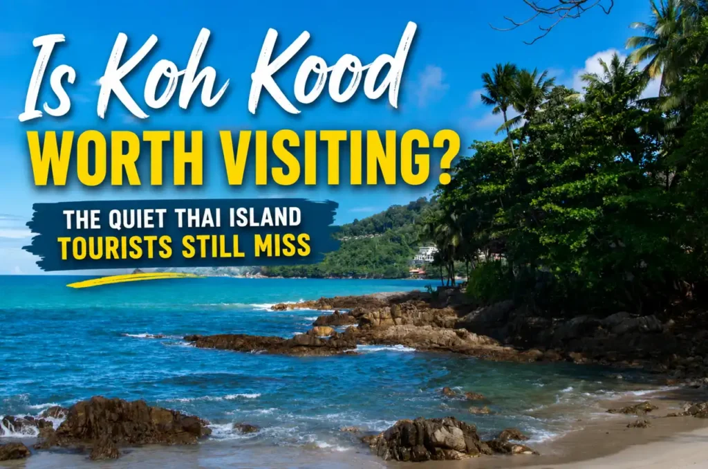Koh Kood beach in Thailand with turquoise water and palm trees featured in a travel guide about whether Koh Kood is worth visiting.