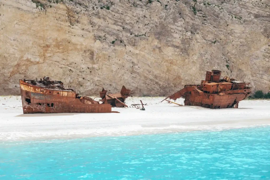 Rusted abandoned shipwreck on Nyang Nyang Beach shoreline in Bali