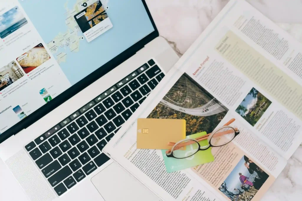 travel planning on laptop with booking and map interface