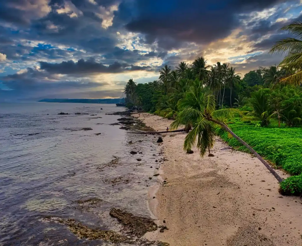 Sunset over hidden beaches in Uluwatu Bali