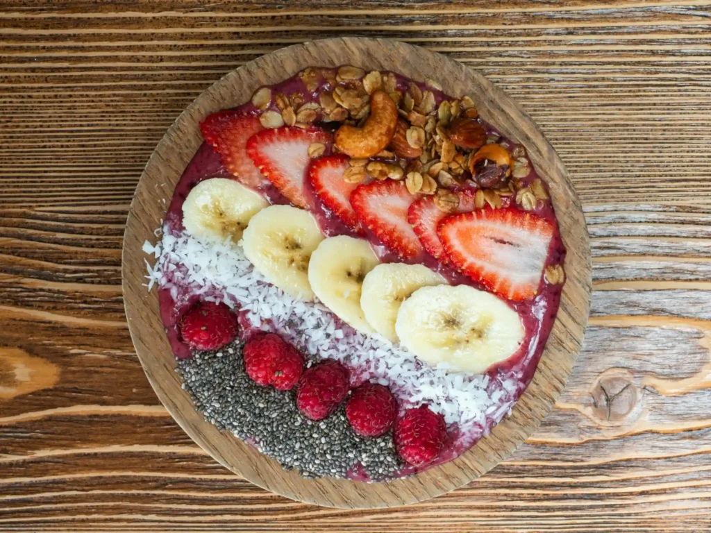 Acai smoothie bowl with banana, strawberries, granola and coconut