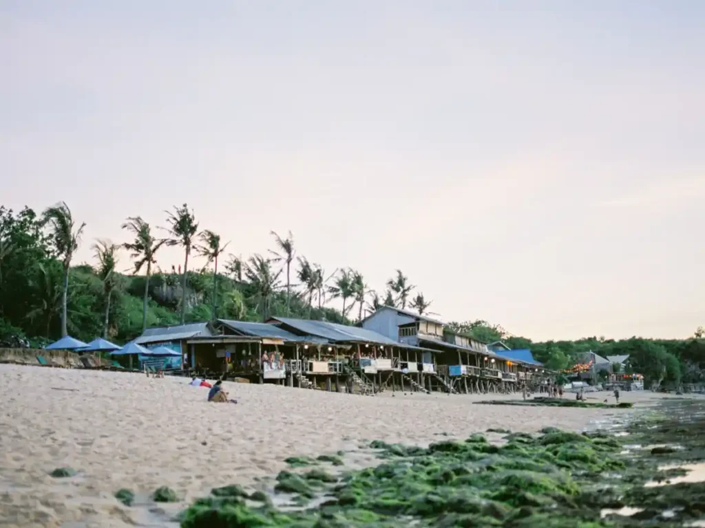 Beachfront cafes along Balangan Beach shoreline.