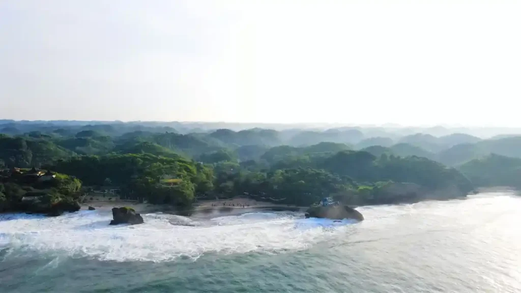 Panoramic drone view of Balangan Beach and surrounding cliffs.