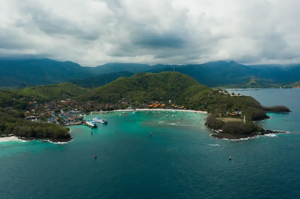 Aerial view of Crystal Bay with turquoise water and surrounding hills.