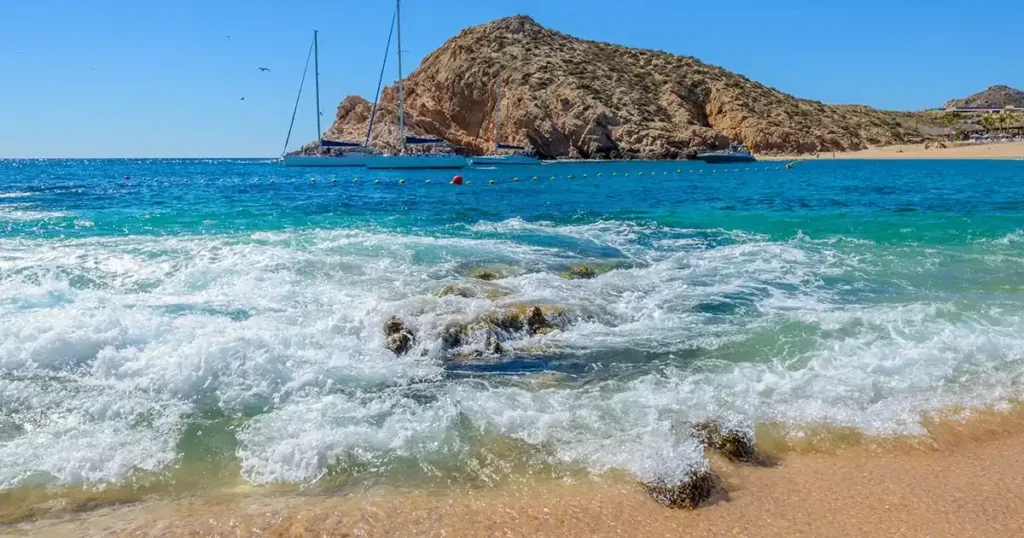 Rocky beach coastline with waves 