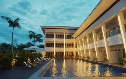 Molly Resort Bohol with a modern outdoor pool and stylish accommodations at sunset.