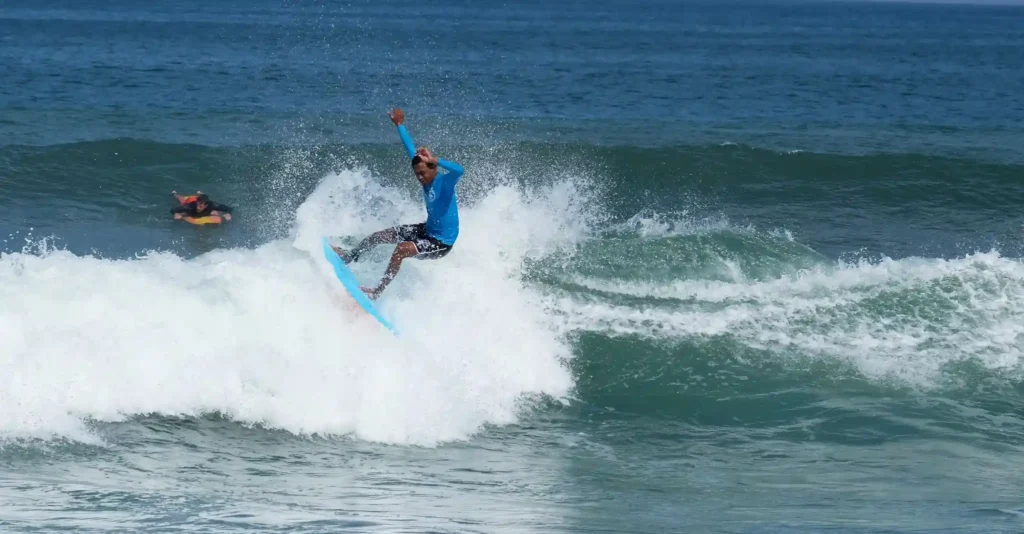 Surfer riding a wave at San Juan Beach
