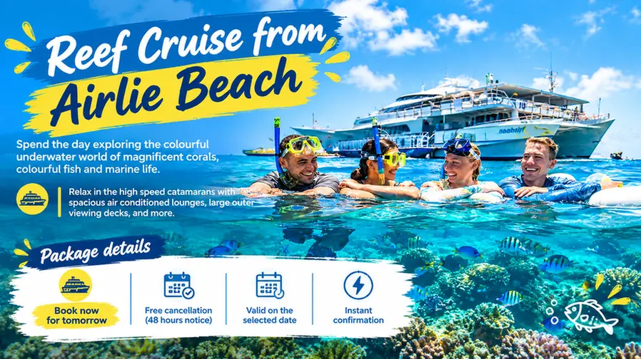 Reef cruise from Airlie Beach with snorkelers and coral reef.