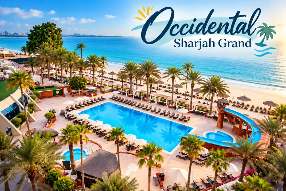 Occidental Sharjah Grand beachfront hotel in Sharjah featuring a large outdoor swimming pool, palm trees, waterslide and private sandy beach overlooking the Arabian Gulf.